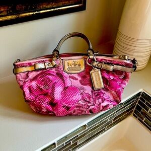 Pink floral Coach handbag with never used shoulder strap. Good condition.